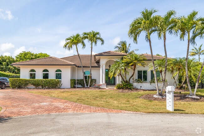 Wake up in your slice of paradise in your new modern-style home in Palmetto Bay, FL.