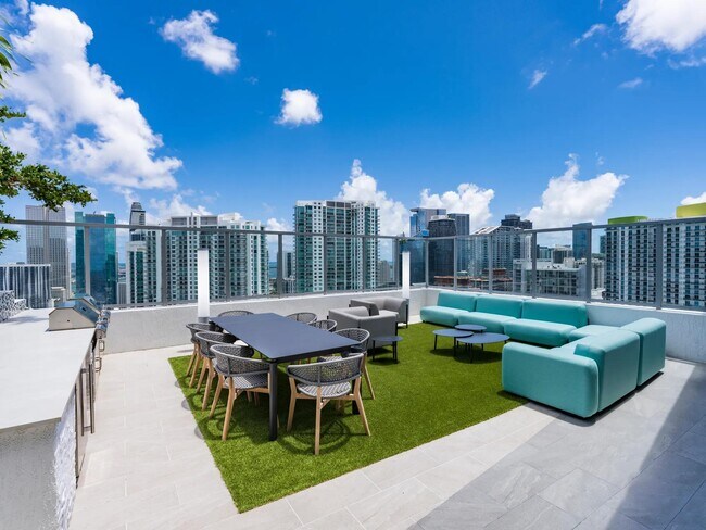 Dine and unwind with panoramic skyline views at Modera Riverside’s rooftop outdoor lounge.