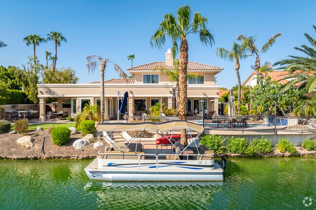 Your Val Vista waterfront home includes a perfect spot for your boat and endless relaxation.