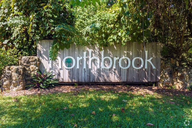 A small sign is visible upon entering Northbrook's tranquil neighborhood.