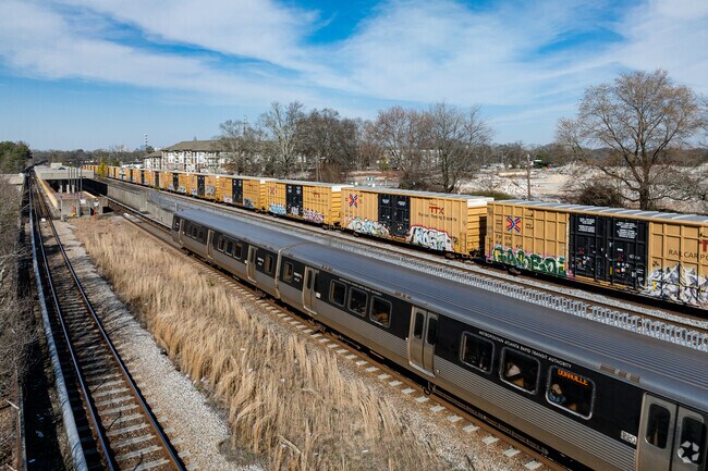 The MARTA trainline runs along the west border of the Sylvan Hills neighborhood with stations.