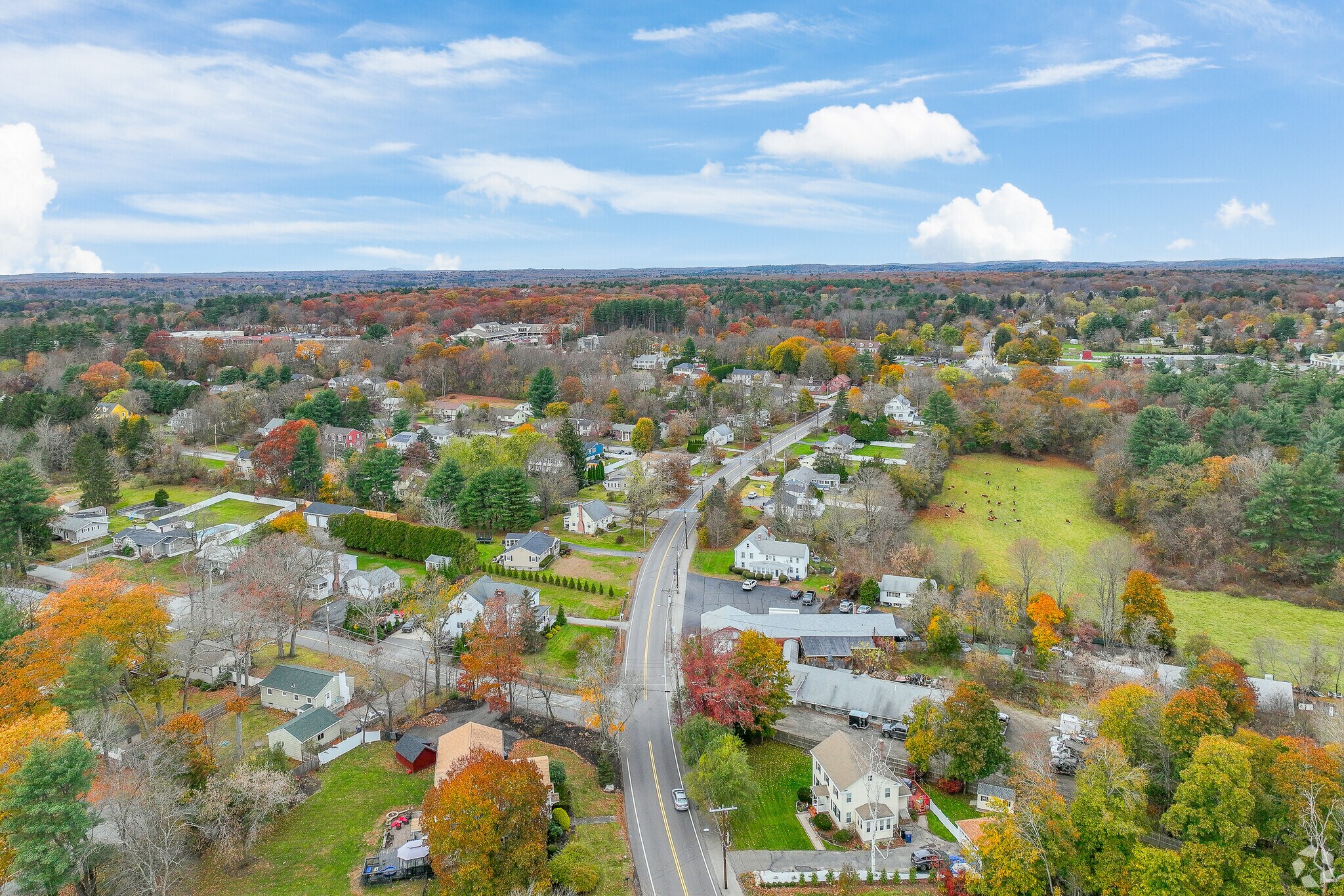 An aerial view of West Medway showcases a breathtaking display of fall foliage.