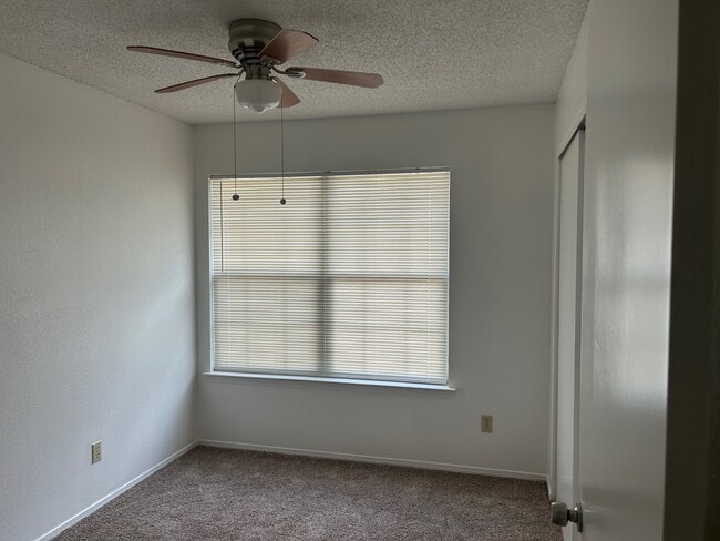 2nd bedroom with new carpet and paint