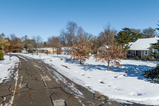 The Forest Hills homes are surrounded by tall trees.
