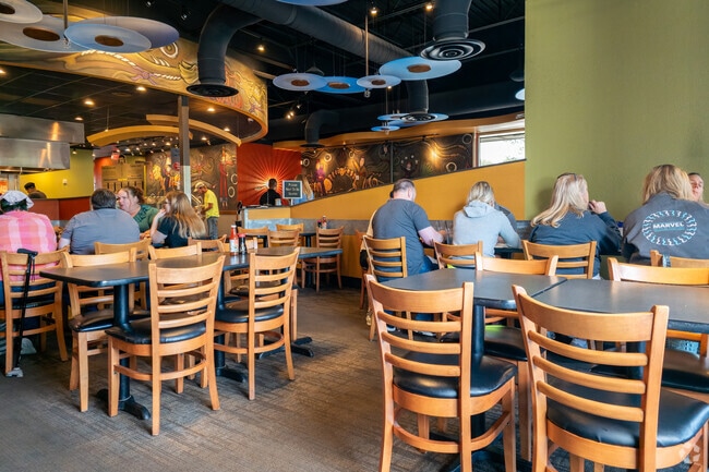 HuHot Mongolian Grill near Park West features all you can eat stir fry in a funky setting.