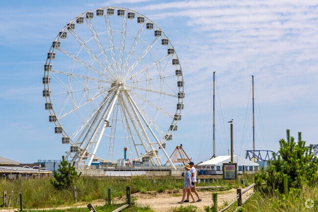 Beaches near Westside are overlooked by the giant ferris wheel on Steel Pier.