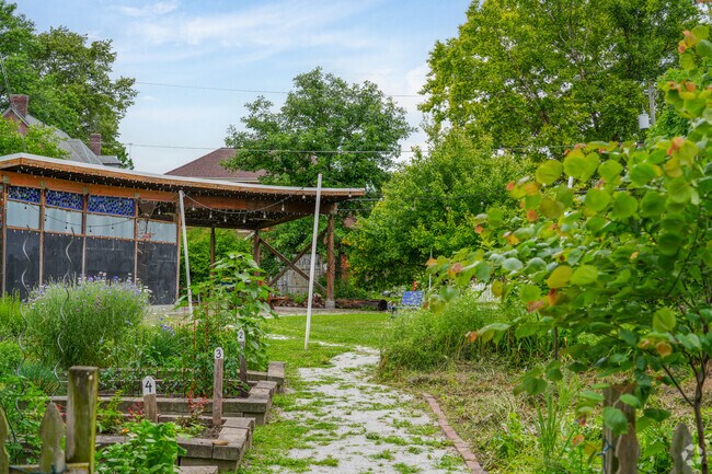 Cottage Home Park has a scenic setting with a community garden, string lights and a stage.