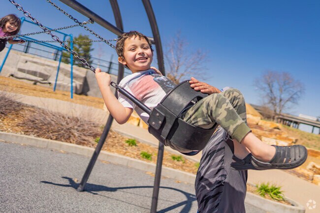 Globeville Landing Park is a great place to take your kids and enjoy the swings.