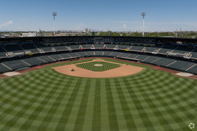 The Smith's Ballpark has a beautifully kept lawn and is cut in a green checkered pattern.