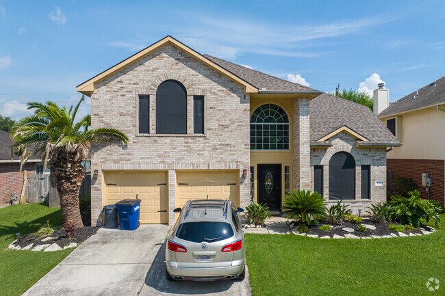Two-story rancher with a double-car garage in Kemah, Texas.