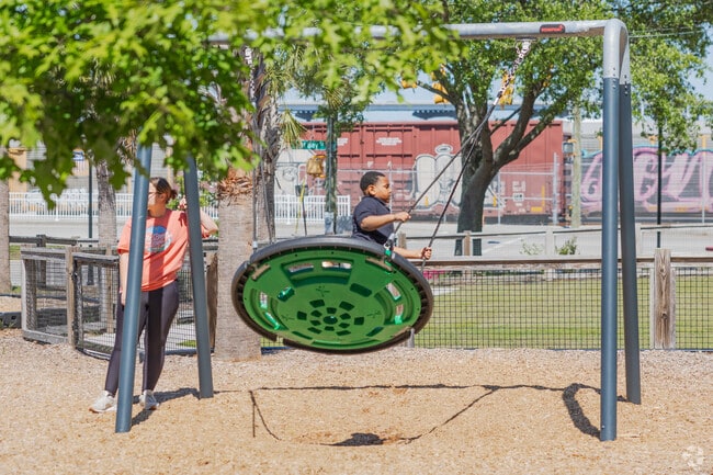Children enjoy the playground activities at the St. Julian Devine Community Center in East Side.