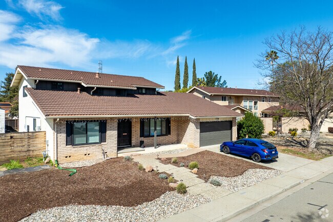 This Diablo Shadows home showcases classic charm, a tile roof, and spacious driveway.