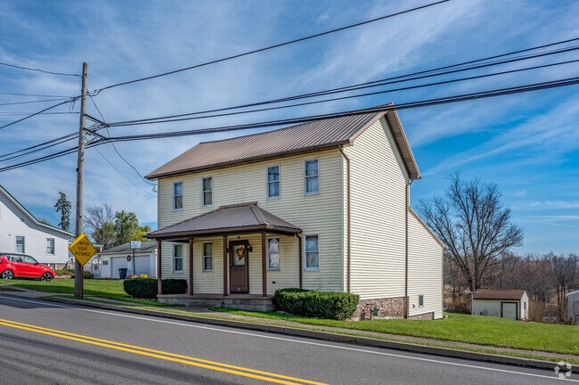 A saltbox-style home sits along a main road in Mount Pleasant Township.