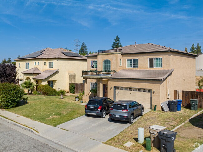 Two-story Spanish style inspired homes with large yards and solar panels in Meadow View.