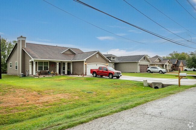 A row of newly built ranch-style homes line the city streets of Santa Fe, TX, south of Houston.