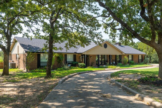 Ranch-style homes often sit on oak-shaded lots across Copper Canyon.