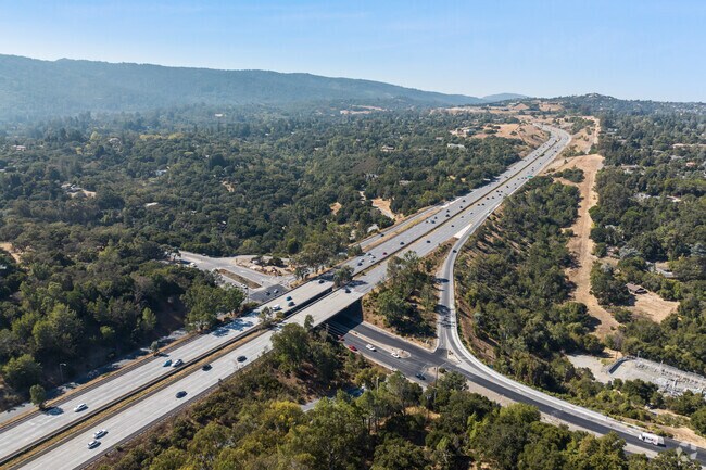 Woodside Hills offers quick freeway access while maintaining secluded, serene hilltop living.