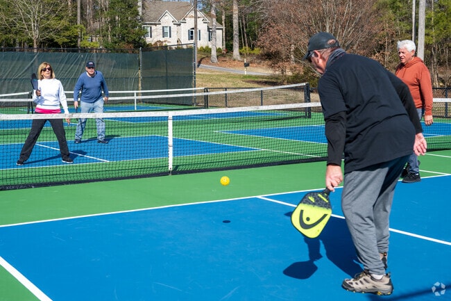 Outdoor activities, including pickleball, are available in The Highlands neighborhood.