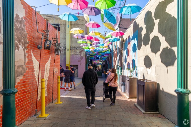 Walk under the colorful umbrellas in Orange Street Alley in Downtown Redlands.