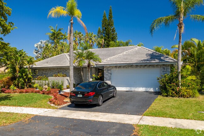 A gorgeous Spanish Revival style home in the City of Coral Springs, FL.