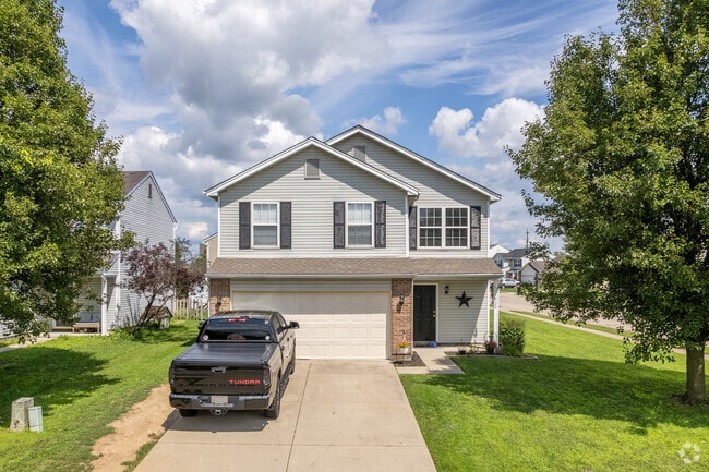 This contemporary home in Trenton features a two-car garage.