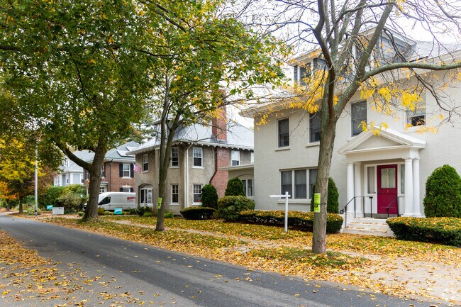 Tree-lined streets and stately early 20th-century homes define this quiet residential area in The Point, blending classic architecture with small-town New England charm.