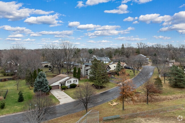 Many of the homes in Beaver Lake are surrounded by large trees.