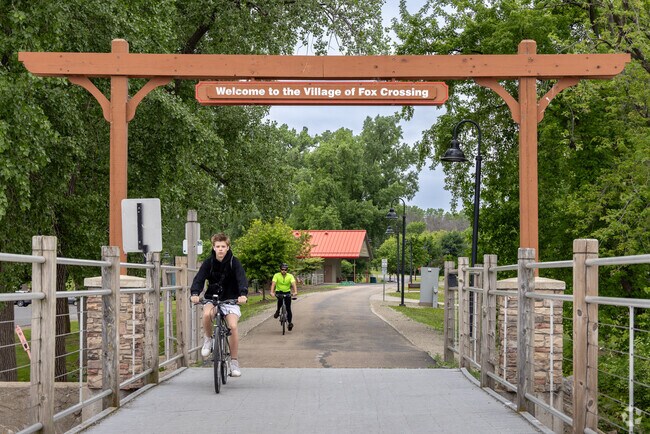 Bikers cruise into the Village of Fox Crossing, greeted by a warm welcome sign.