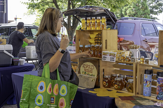 Westfall residents enjoying a little shopping at the local food market.