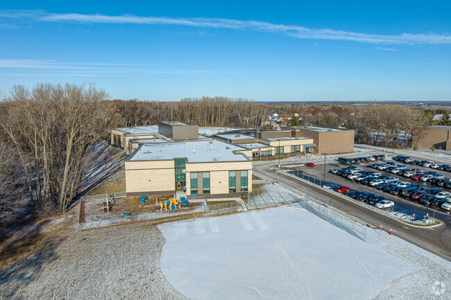 Eagle Point Elementary has a small playground and baseball field out front.