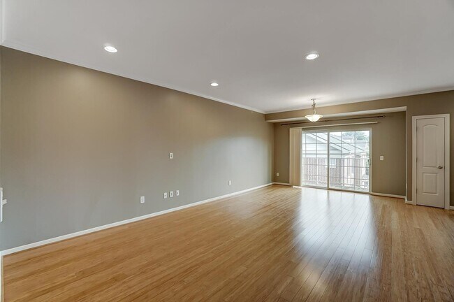Large, open living room with sliding door walk-out to the balcony overlooking Marburg Square