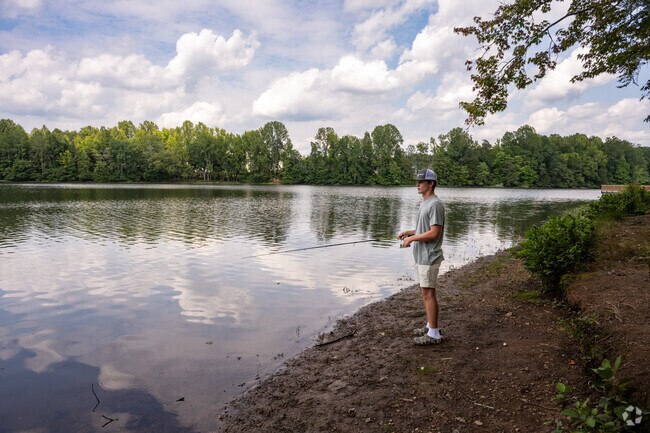 Fishing at Lake Michael Park draws locals to its wooded shoreline and calm waters.