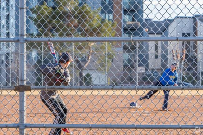 People practicing baseball in Taft Park near the Diamond Lake neighborhood.