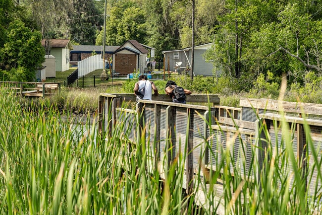 Carver and Edgewood Manor residents enjoying the dock at Charles Reese Memorial Park.
