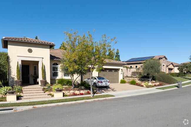 Residents take care of their lawns in Woodlands.