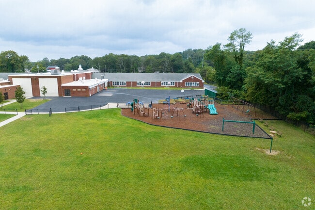 NID 537930 Wading River School is located right off Route 25a near a commercial district.