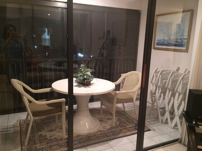 Glass enclosed patio overlooking pond