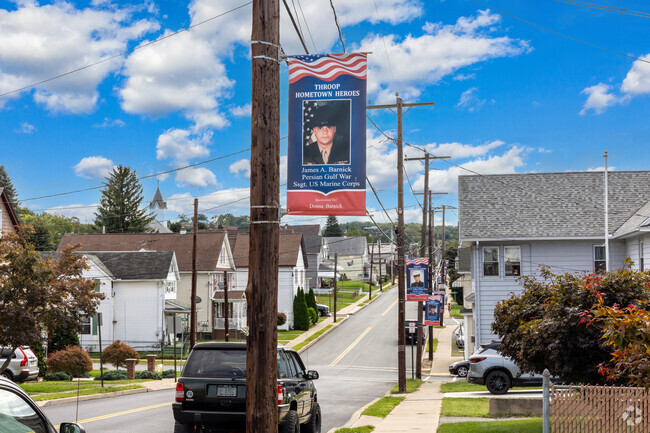 Hometown hero flags line the streets in Throop.