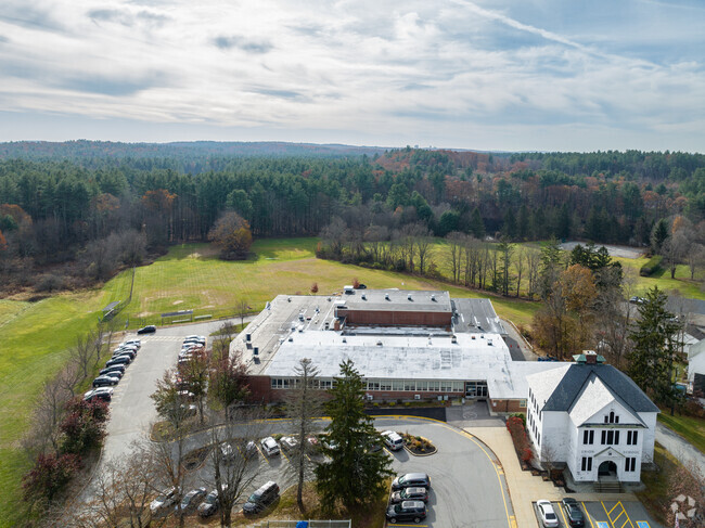 Swallow Union Elementary School is surrounded by dense woods in Dunstable, MA.