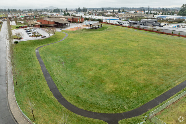 Behind Orchards Elementary School is a large field and paved path for exercise.