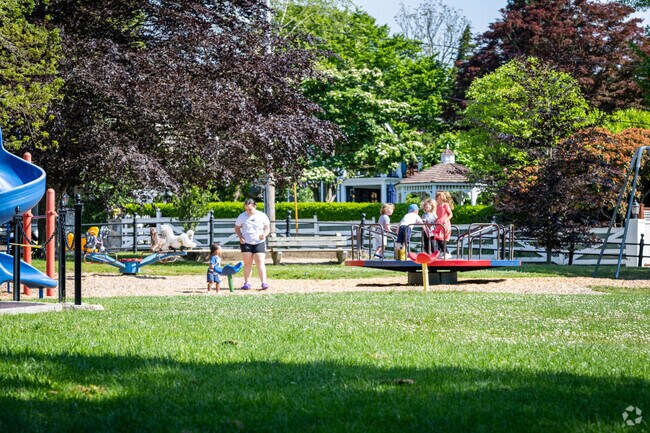 Families and children delight in a day at the Aquidneck Park playground in Historic Hill, RI.