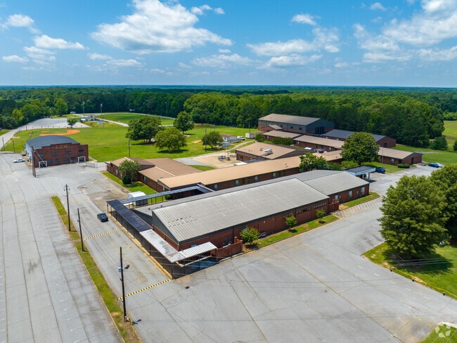 East Coweta Middle School has a large campus with green landscapes.