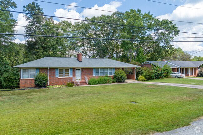 Rows of traditional brick ranch homes line the neighborhood streets of the town of Williamston.
