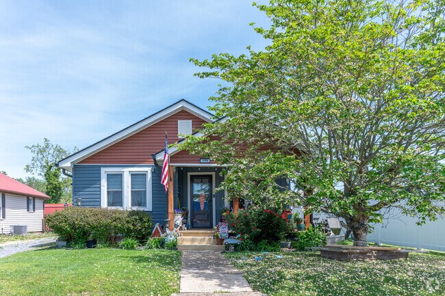 A cottage on Highland Street stands out with its decorations and neat landscaping.