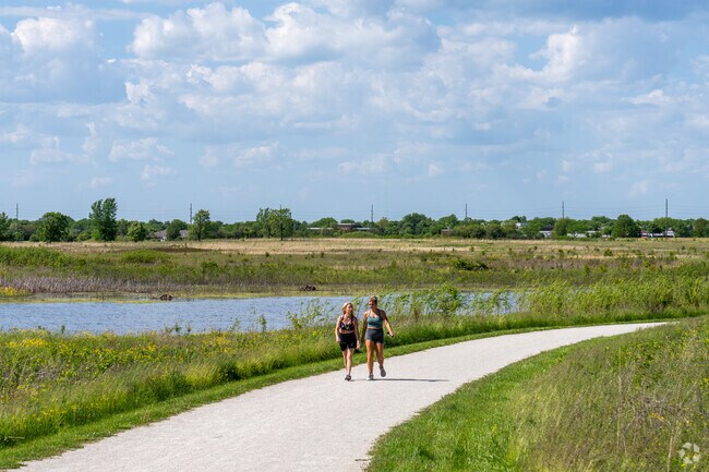 Take a walk along the paved paths found at Springbrook Prairie Forest Preserve.