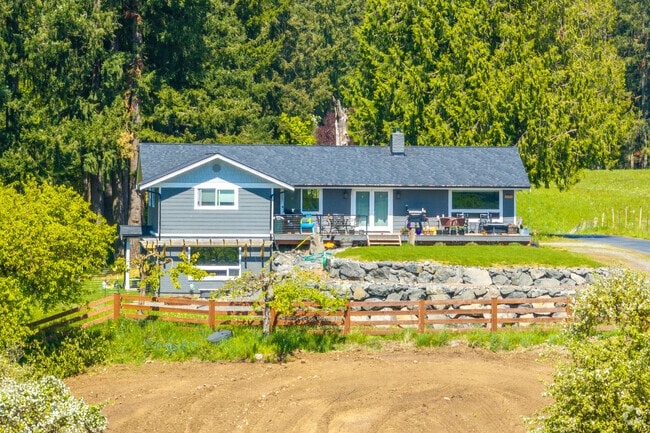 This beautiful rancher has a cute rock garden and fence to draw in the looks in Wabash.