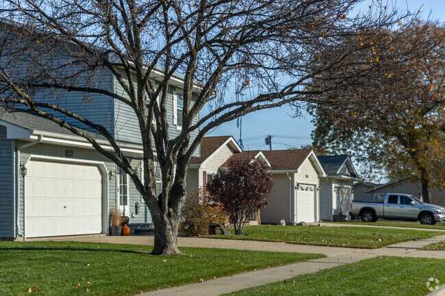 Lovely row of homes covered with mature trees in the Stocker neighborhood.