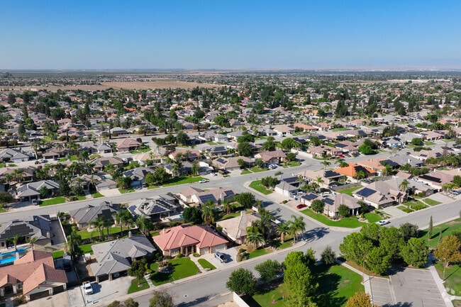 Rising above the neighborhood of Shiloh Estates, you can see big yards and backyard pools.