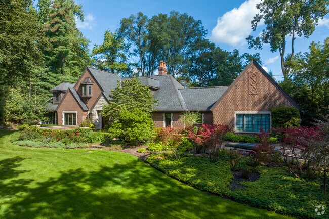 A modern take on a Tudor home nestled into the landscape in Franklin.