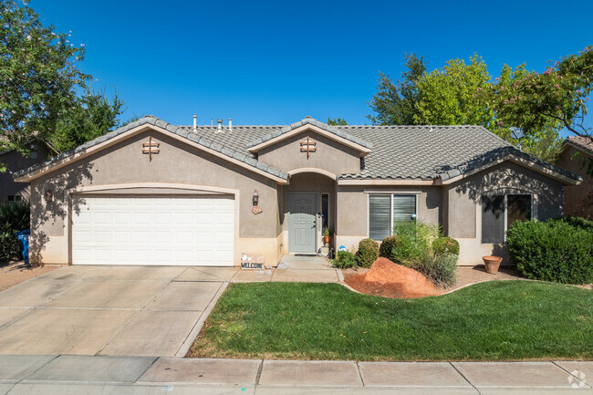 Homes in Painted Desert have well-kept front lawns and multi-car garages.